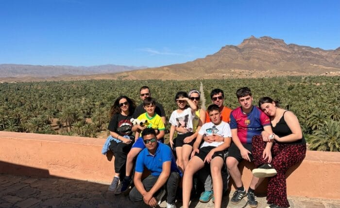 Group of international tourists enjoying a desert excursion in Agdz Morocco